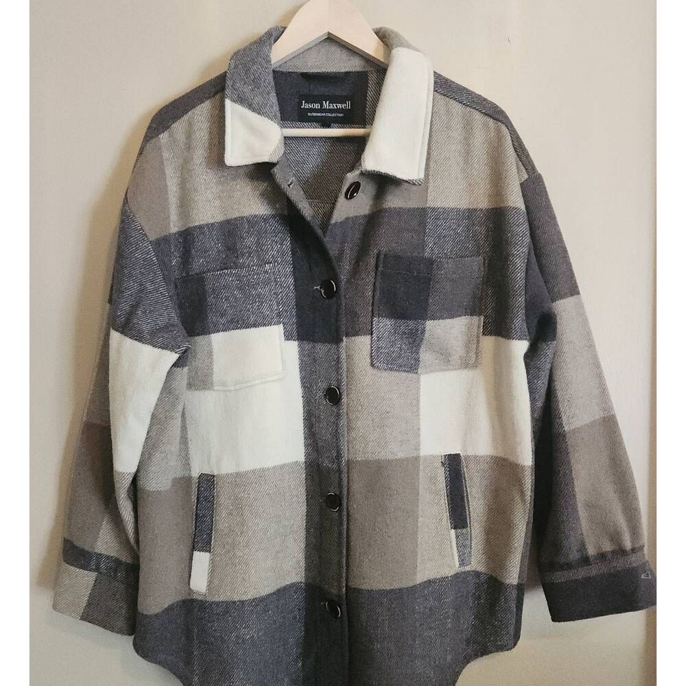 J49 Jason Maxwell Outerwear Collection jacket with fringe trim on back.